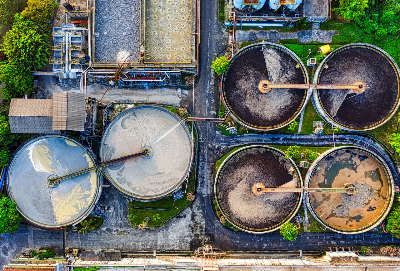 Top-down view of a water treatment plant in an industrial area of Indonesia.